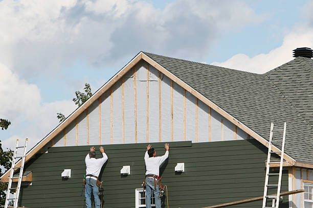 Professional Siding Repair technician working in Wellington, FL